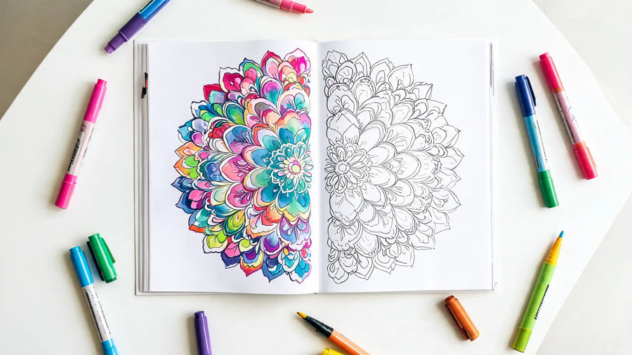 Coloriage adulte d'un mandala fleuri en cours de réalisation aux marqueurs acryliques colorés, vue plongeante sur la page